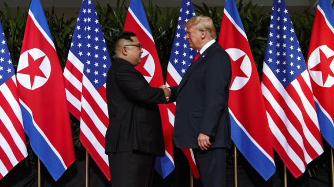 US President Donald Trump and the North Korean Supreme Leader Kim Jong-Un shake hands - Sakshi Post