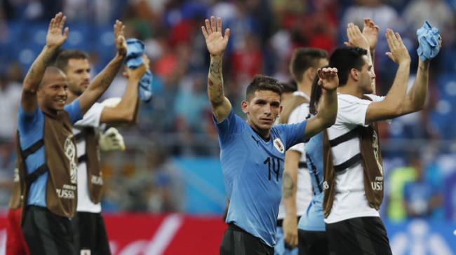 Uruguays Lucas Torreira, center, celebrates with teammates as they won the group A match between Uruguay and Saudi Arabia at the 2018 soccer World Cup in Rostov Arena in Rostov-on-Don, Russia, Wednesday, June 20, 2018.&amp;amp;nbsp; - Sakshi Post