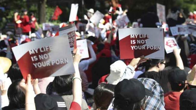 Protesters, many of them wearing red T-shirts with signs that read “Angry women will change the world." Protesters, many of them wearing red T-shirts with signs that read “Angry women will change the world." - Sakshi Post