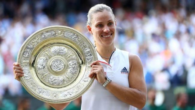 Angelique Kerber poses with the Wimbledon 2018 title. Angelique Kerber poses with the Wimbledon 2018 title. - Sakshi Post