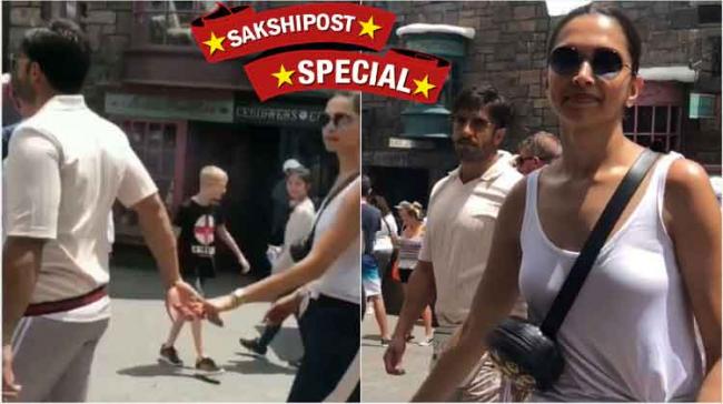 The fan shot a video of the actors which shows Ranveer holding Deepika’s hand on the streets of Orlando - Sakshi Post
