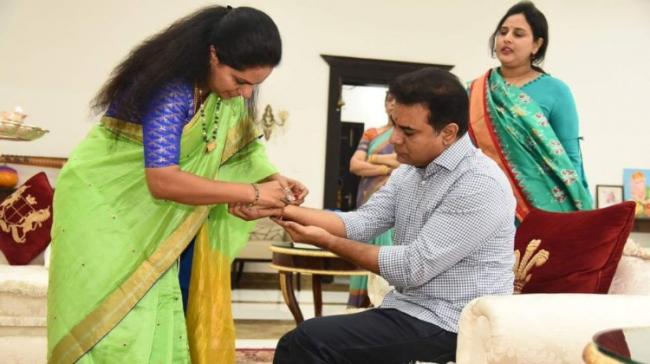 MP Kavitha tying rakhi to her brother KTR - Sakshi Post