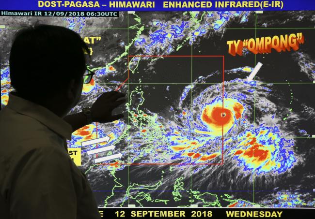 Filipino forecaster Meno Mendoza shows the path of Typhoon Mangkhut, locally named “Typhoon Ompong” &amp;amp;nbsp; - Sakshi Post