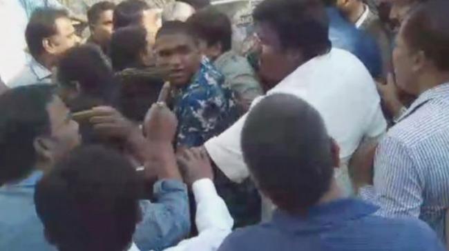 Workers of both the parties in a scuffle - Sakshi Post