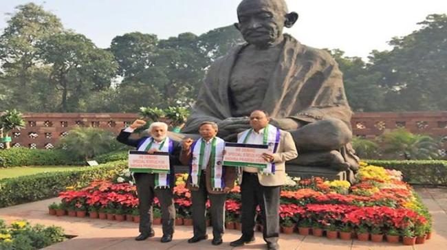 Vijayasai Reddy, Vemireddy Prabhakar Reddy and former MP Vara Prasad staged protests at the Gandhi statue here at the Parliament  Vijayasai Reddy, Vemireddy Prabhakar Reddy and former MP Vara Prasad staged protests at the Gandhi statue here at the Parliament  - Sakshi Post