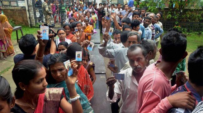 Voters standing in a queue to caste their vote&amp;amp;nbsp; - Sakshi Post
