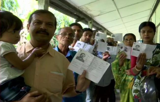 People queue up for voting in the third phase - Sakshi Post