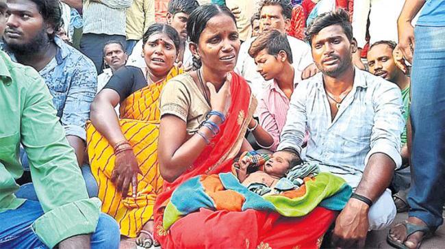 The infant’s family protest outside the hospital - Sakshi Post