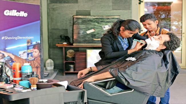 Tendulkar getting a shave from the two ‘barbershop girls’. - Sakshi Post