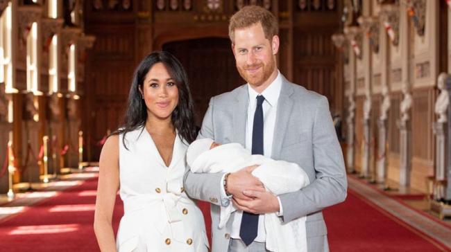 Prince Harry and Meghan Markle with their first child - Sakshi Post