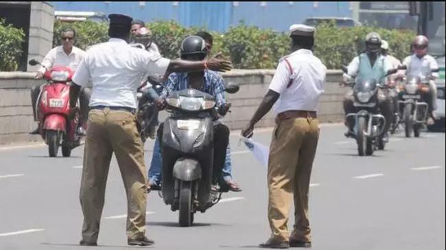 Traffic Cops Stopping People Traffic Cops Stopping People - Sakshi Post