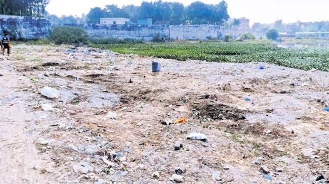 Kaidammakunta lake in Hafizpet has been turning into a dumping yard as it is filled with construction waste and most of the garbage generated on a daily basis - Sakshi Post
