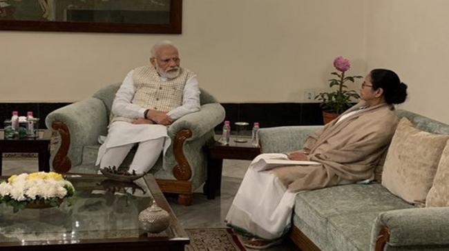 West Bengal Chief Minister Mamata Banerjee called on Prime Minister Narendra Modi at the Raj Bhavan - Sakshi Post