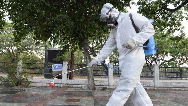 &amp;lt;a&amp;gt;A member from Disaster Response Force (DRF) of Telangana State, wearing a protective gear sprays disinfectant on a pedestrian footpath &amp;lt;/a&amp;gt; - Sakshi Post