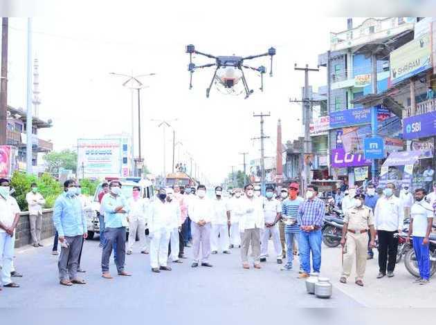 Telangana Minister for Panchayat Raj and Rural Development Errabelli Dayakar Rao on Saturday kick-started drone spray in Torrur town of Mahabubabad - Sakshi Post