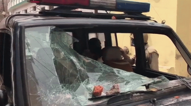 Police car in a damaged state after stones pelted&amp;amp;nbsp; - Sakshi Post