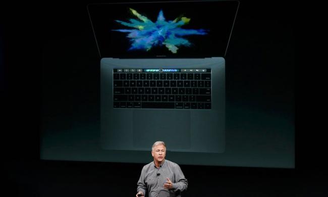 MacBook Pro models shown off at a special event at Apple’s headquarters in Silicon Valley touted keyboards that had Touch Bar controls where function keys have traditionally been positioned - Sakshi Post