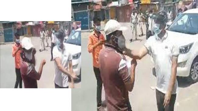 Screen grab from the video Chhattisgarh CM removes Surajpur DM after video shows him hitting man for violating COVID norms - Sakshi Post