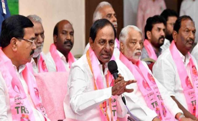 A file photo of Telangana CM K Chandrasekhar Rao with party leaders - Sakshi Post
