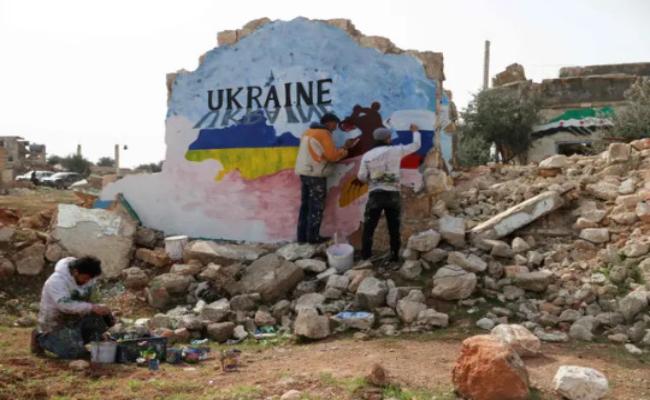 Syrians protesting Russian war on Ukraine though a mural painting Syrians protesting Russian war on Ukraine though a mural painting - Sakshi Post