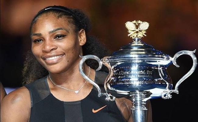 File photo : US Tennis player Serena Williams with a trophy -Sakshi Post