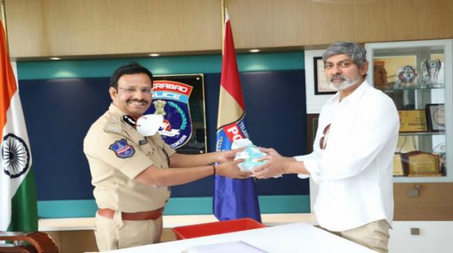 Jagapati Babu Giving Masks, Sanitisers To V C Sajjanar - Sakshi Post