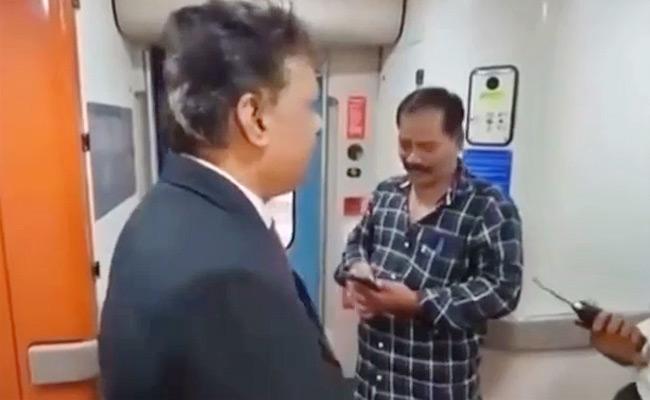 Screen grab from video AP Man Stuck On Vande Bharat Express Train While Taking Selfies - Sakshi Post
