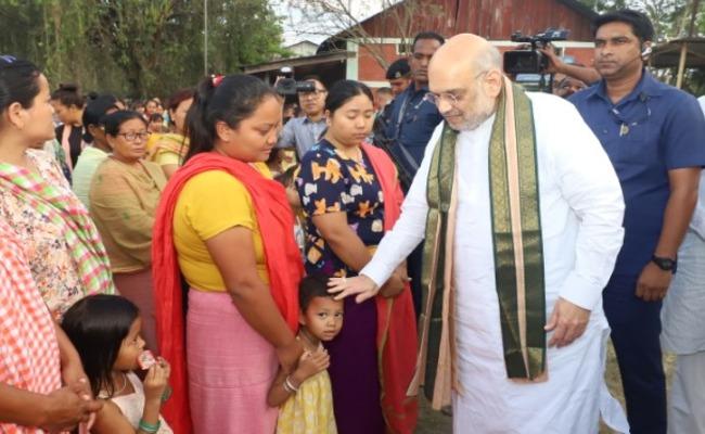 Home Minister Amit Shah interacting with members of the Meitei community in a relief camp in Imphal city of Manipur. (Source: @AmitShah/Twitter) - Sakshi Post
